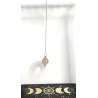 Pendule Quartz rose poli et métal.